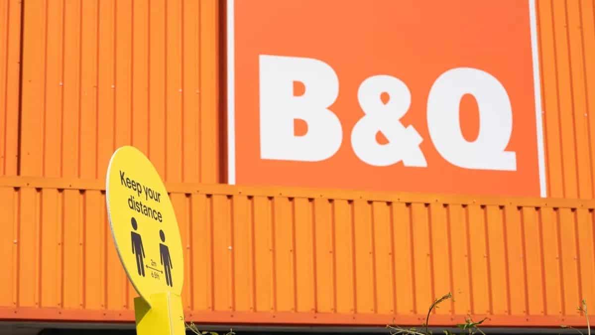 B&Q retail store exterior with bright orange facade and signage.